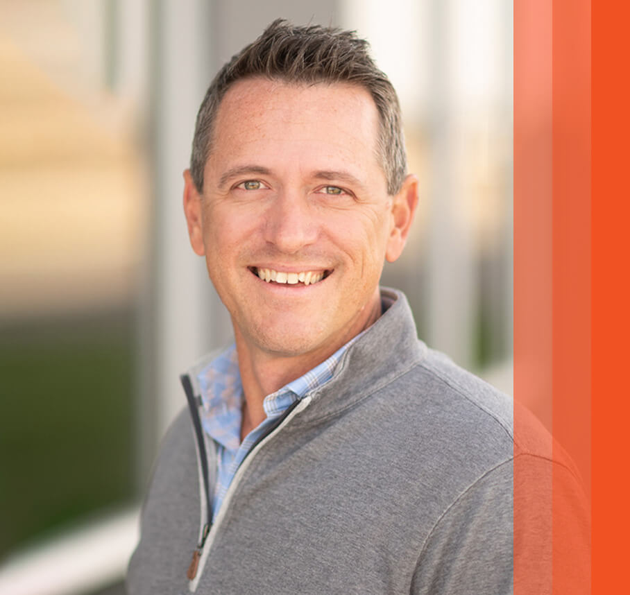 Matt headshot with orange bars.