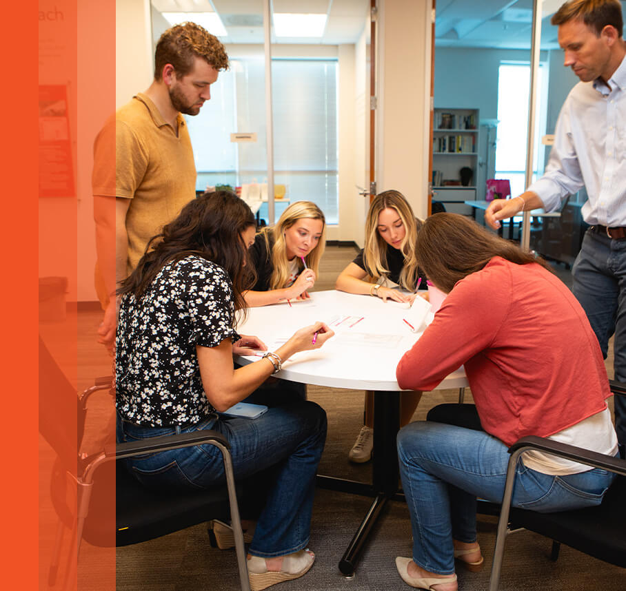 Nate’s employees writing messages of hope for National Breast Cancer Foundation Hope Kits.