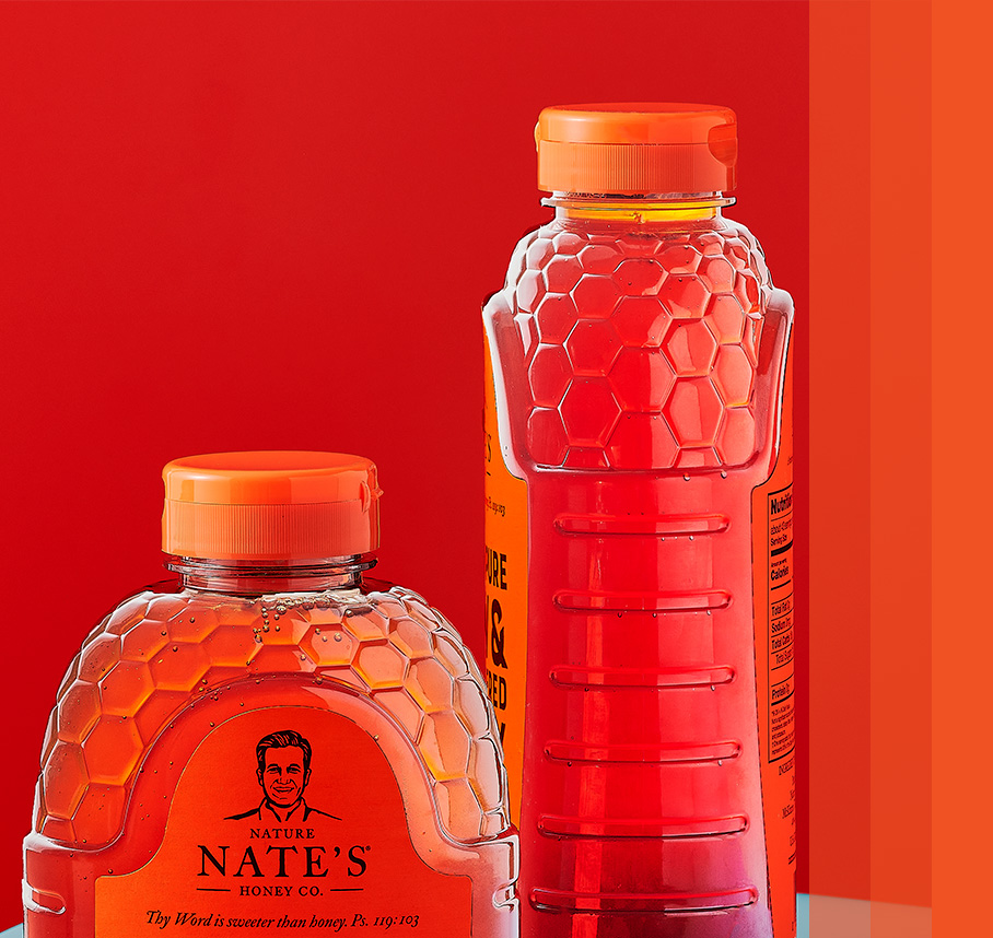 Classic bottles of Nate's Honey with orange bars on the right.