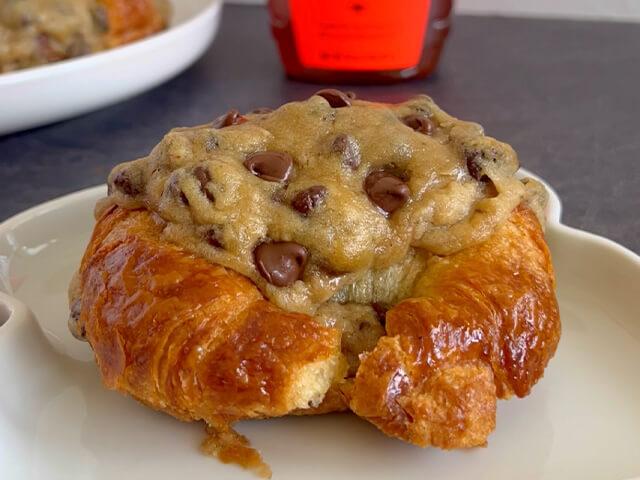 Round croissant stuffed with cooked chocolate chip cookie dough.