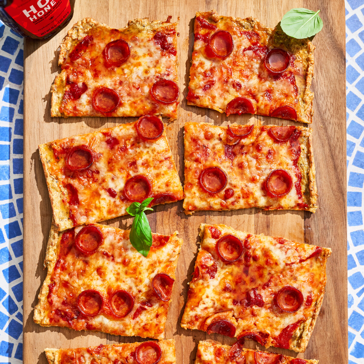 Hot Honey High Protein Pepperoni Pizza on wooden board.