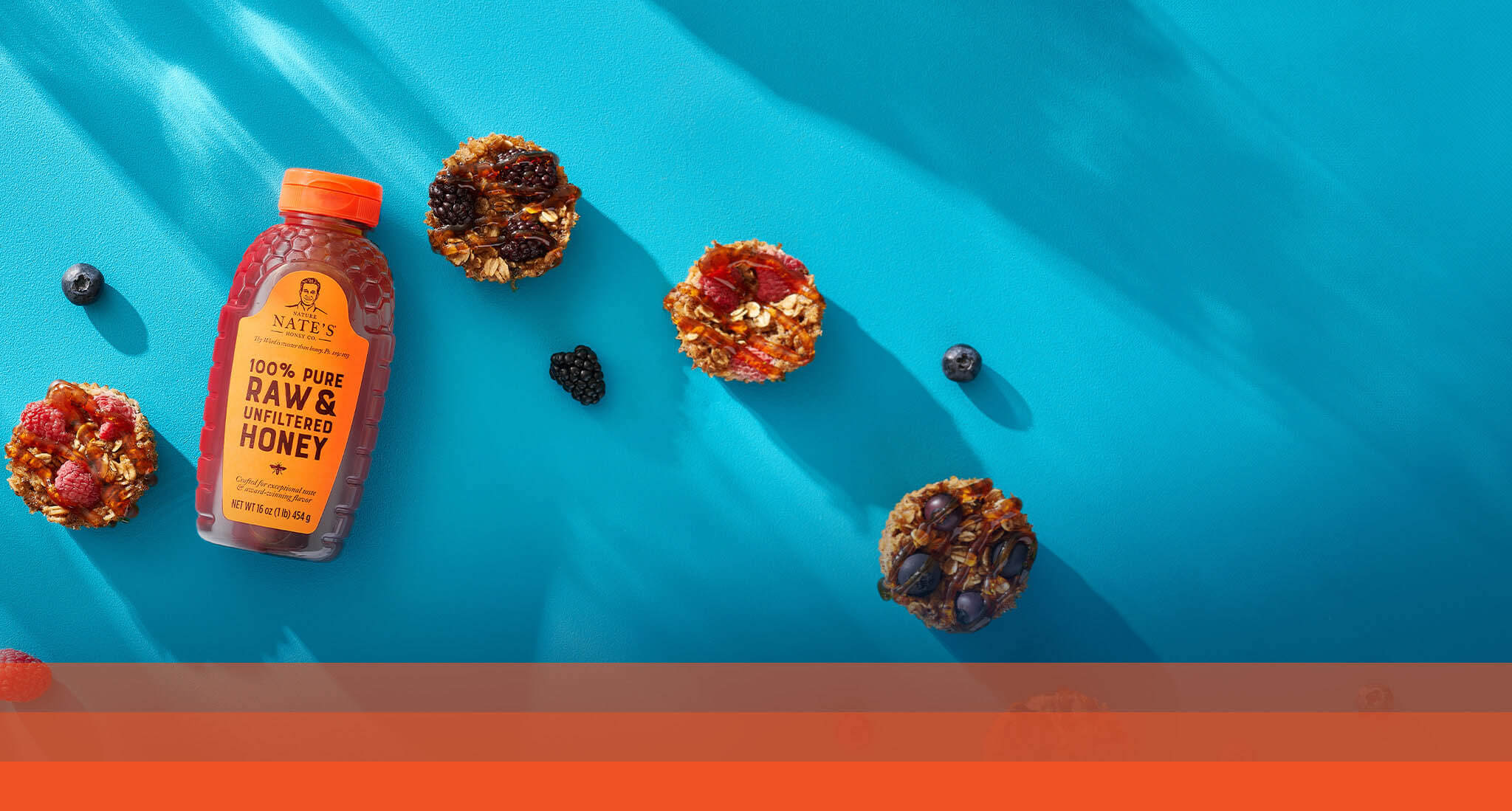 Nate's honey bottle with baked oatmeal cups made with oats, fruit and Nate’s honey.