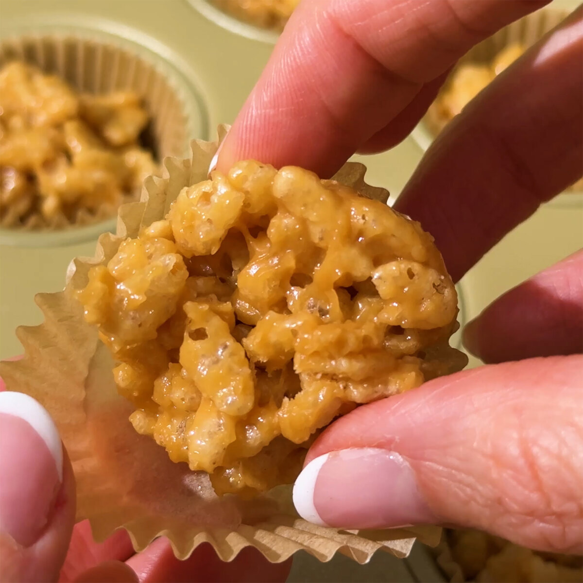 Peanut Butter Rice Crispy Clusters in muffin tin.