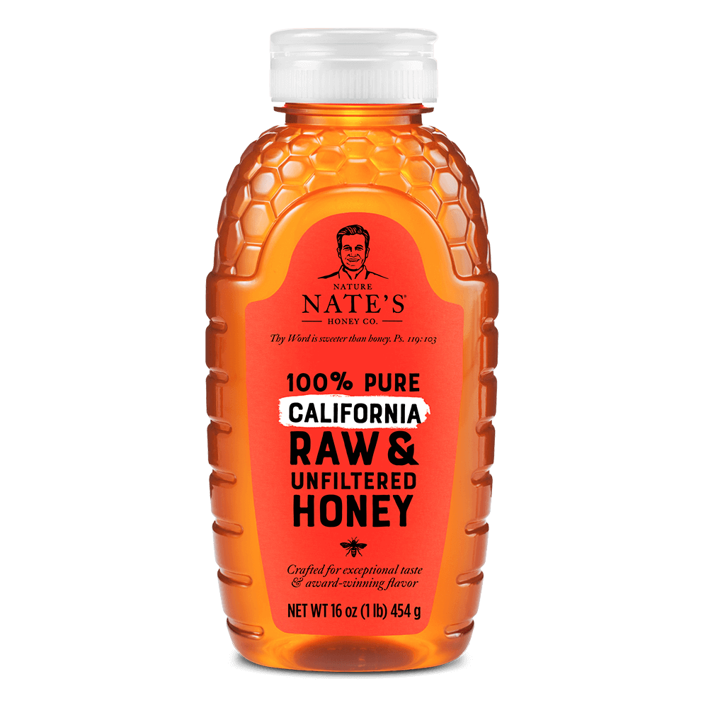 Nate's California raw & unfiltered honey bottle isolated on white.