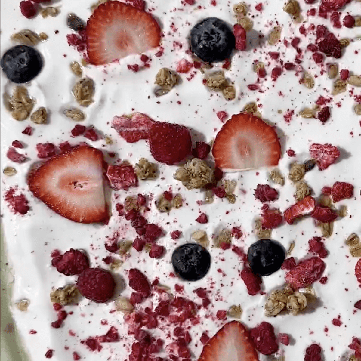 Yogurt honey granola bark made with yogurt, berries, granola and Nate’s honey.